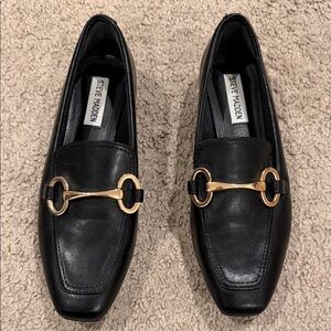 Steve Madden Black Slip-Ons with Gold Detail